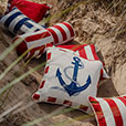 RIPTIDE NECKROLL PILLOW IN RED